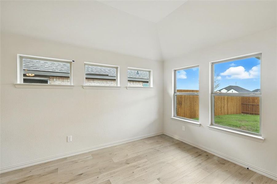 Unfurnished room featuring light wood-type flooring and baseboards Unfurnished room featuring light wood-type flooring and baseboards