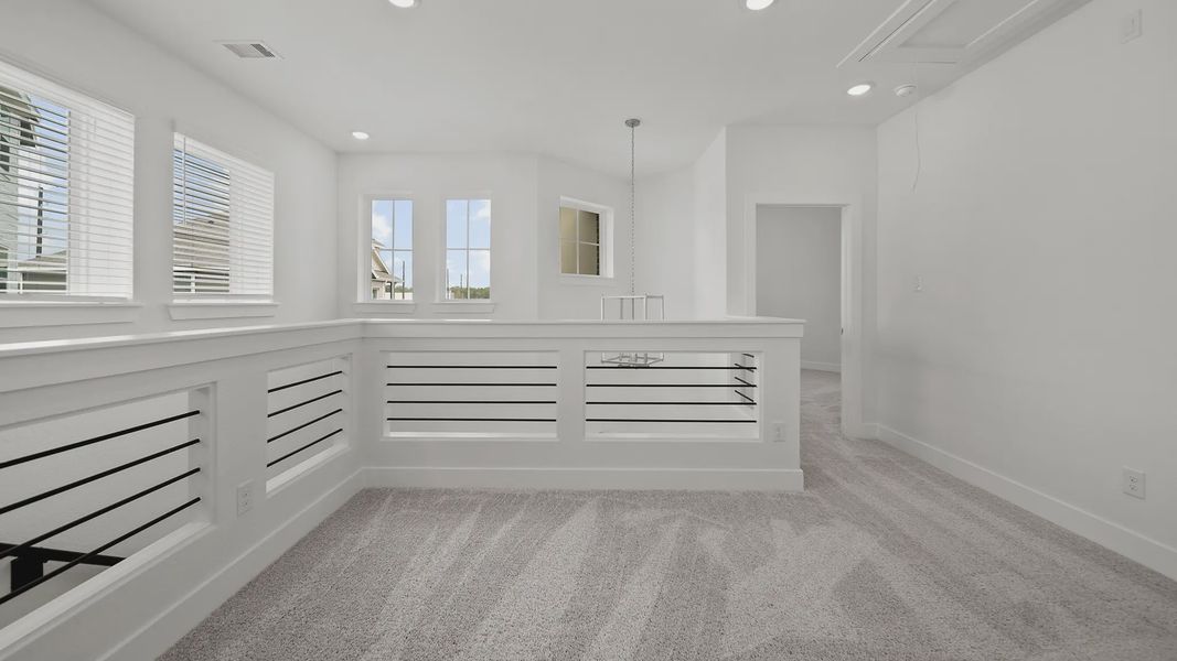 Representative unfurnished interior of a home built from the Rosewood by Chesmar Homes in Sienna Courtyard, Missouri City (Image 12).