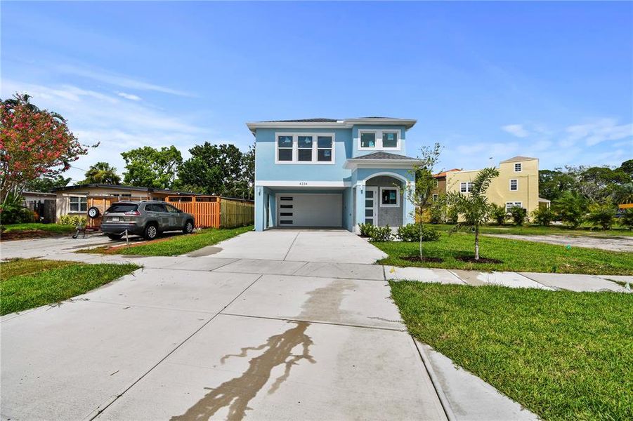 Front exterior of a new home in , St. Petersburg, FL, highlighting curb appeal (Image 26).