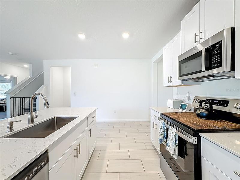 Furnished interior view inside a new home in Berry Bay: The Executives, Wimauma (Image 12).