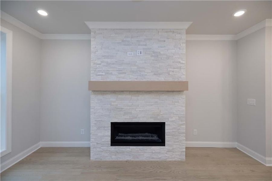 Gorgeous gas fireplace.*Please note photos shown are of the Ellington plan but not of the actual home.