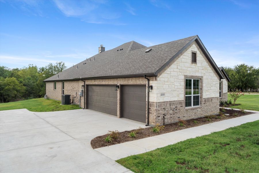 Front exterior of a new home in Vista Oaks Estates, Royse City, TX, highlighting curb appeal (Image 23).