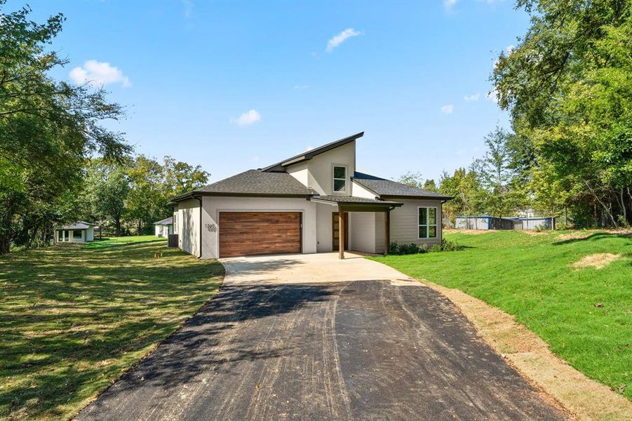 Front exterior of a new home in , Lindale, TX, highlighting curb appeal (Image 2). Front exterior of a new home in , Lindale, TX, highlighting curb appeal (Image 2).