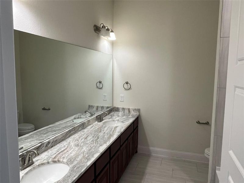 Bathroom featuring toilet and vanity