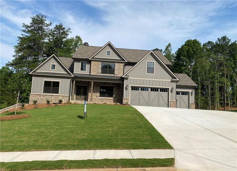 Front exterior of a new home in Spring Creek, Monroe, GA, highlighting curb appeal (Image 4). Front exterior of a new home in Spring Creek, Monroe, GA, highlighting curb appeal (Image 4).
