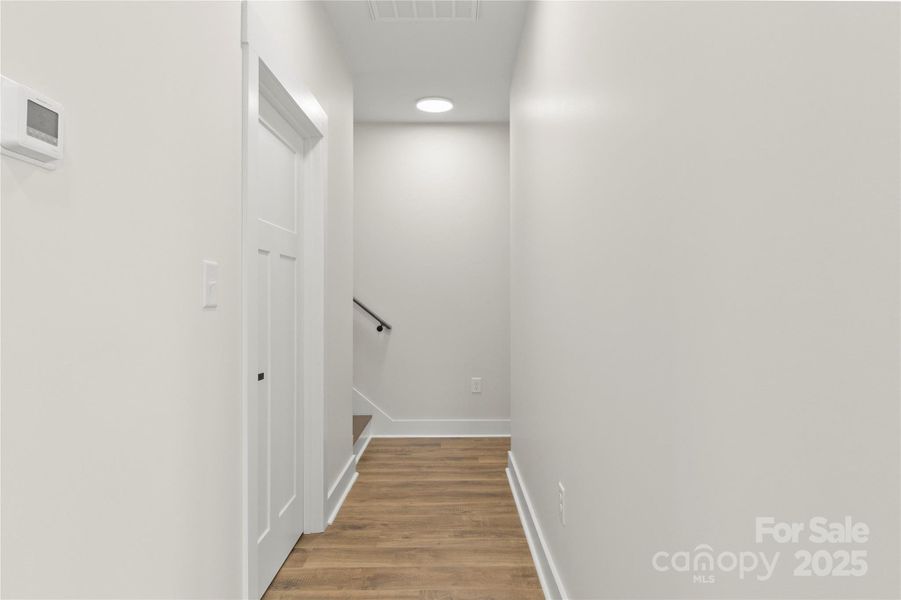 Hall way towards bonus room and primary bedroom