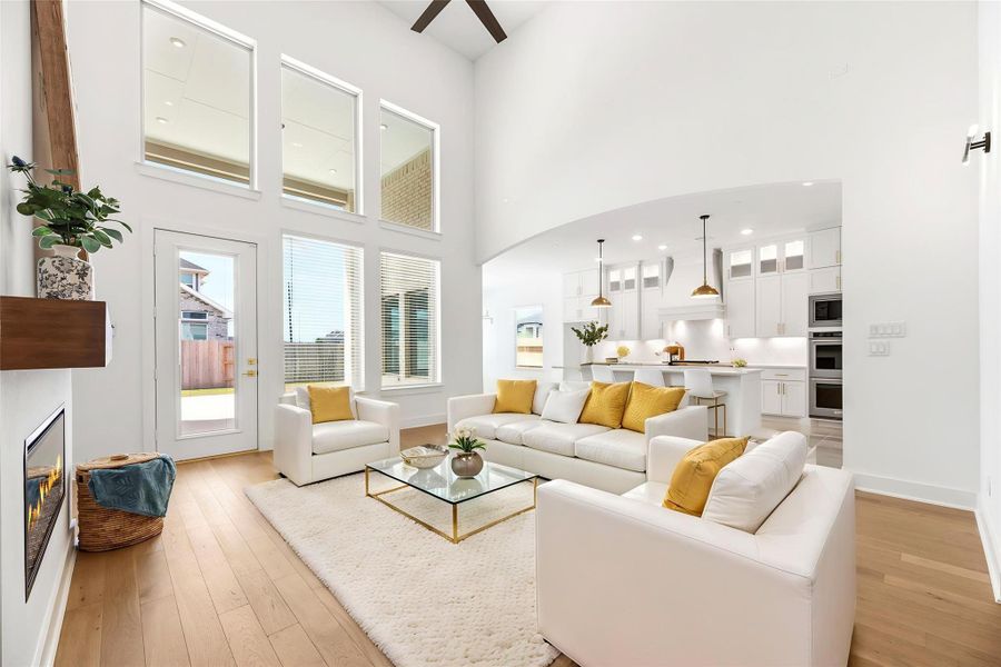 Soaring ceilings accentuate the grandeur of this space, where large windows offer incredible clarity and easy access to the backyard, flowing directly into the chef-grade kitchen.