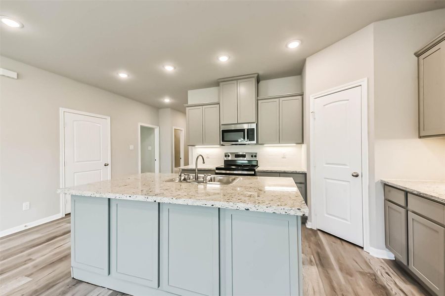 The kitchen is adorned with all the latest finishes and a calming color palette, perfectly showcasing the ethereal vibe that Shoreacres exudes. The kitchen is adorned with all the latest finishes and a calming color palette, perfectly showcasing the ethereal vibe that Shoreacres exudes.