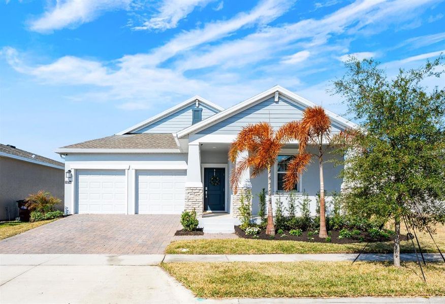 Front exterior of a new home in Tohoqua, Kissimmee, FL, highlighting curb appeal (Image 2).