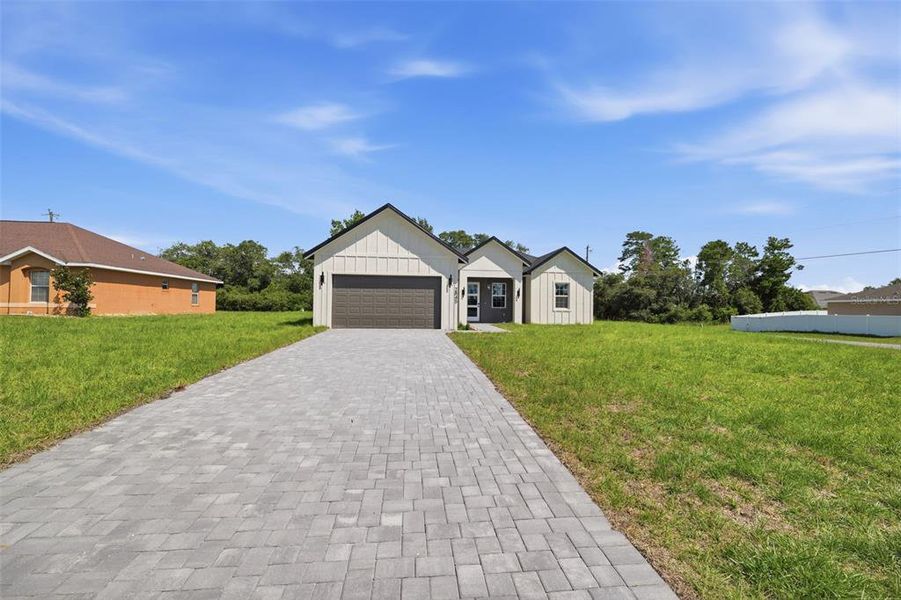 Front exterior of a new home in , Ocala, FL, highlighting curb appeal (Image 19).