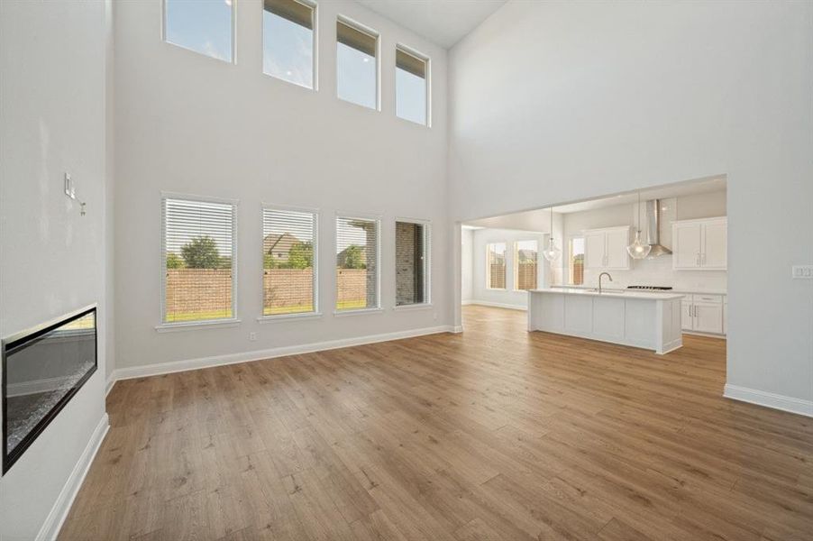 Spacious interior with high ceilings and wood-finish flooring