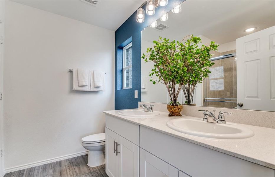 Owner's private bath with double vanity