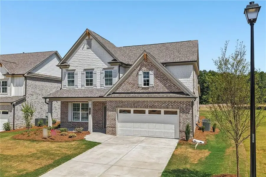 Front exterior of a new home in , Hoschton, GA, highlighting curb appeal (Image 2). Front exterior of a new home in , Hoschton, GA, highlighting curb appeal (Image 2).