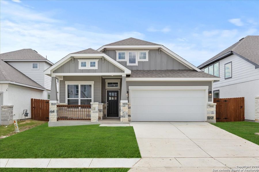 Front exterior of a new home in Meyer Ranch, New Braunfels, TX, highlighting curb appeal (Image 14).
