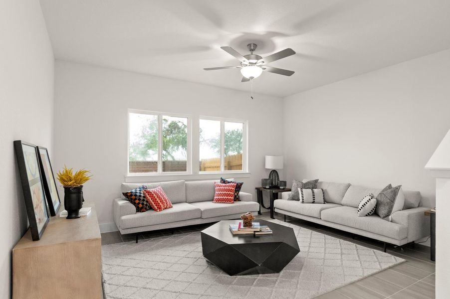 A naturally illuminated living area offers a calming ambiance, with ample space for relaxation and social gatherings.