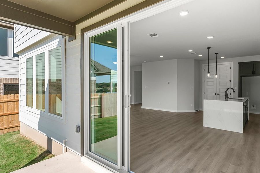 Exterior details and patio area of a home in Terrace Collection at Lariat, Liberty Hill (Image 4). Exterior details and patio area of a home in Terrace Collection at Lariat, Liberty Hill (Image 4).