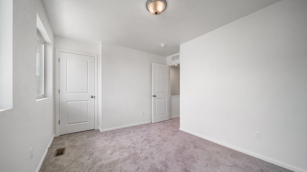 Spacious, unfurnished interior of a new home in Banning Lewis Ranch, Colorado Springs (Image 10).