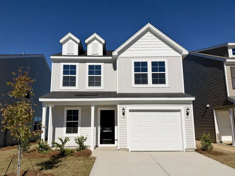 Front exterior of a new home in Ellington, Elgin, SC, highlighting curb appeal (Image 1). Front exterior of a new home in Ellington, Elgin, SC, highlighting curb appeal (Image 1).