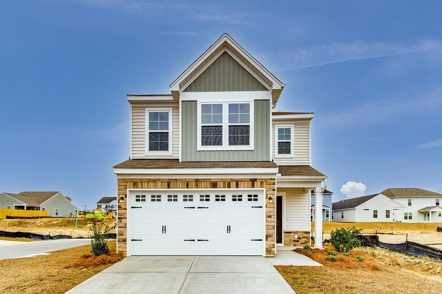 Front exterior of a new home in Winston Point, Gilbert, SC, highlighting curb appeal (Image 1).