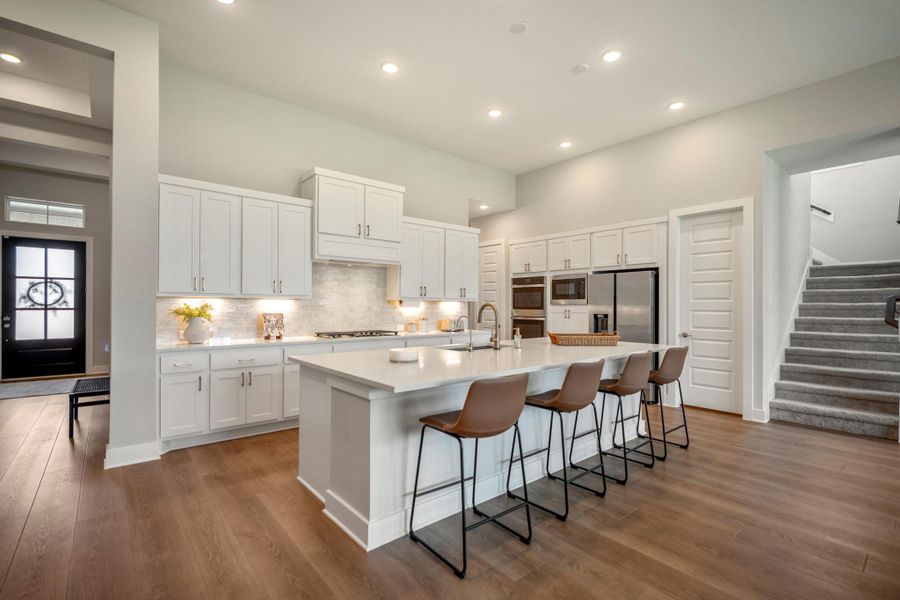 Abundant cabinetry, pots and pans drawers and a deep walk-in pantry make it easy to keep cookware, serving pieces and everyday essentials organized and close at hand.