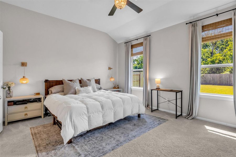 Located at the back of the home, this spacious first-floor bedroom overlooks the backyard and is filled with natural light.