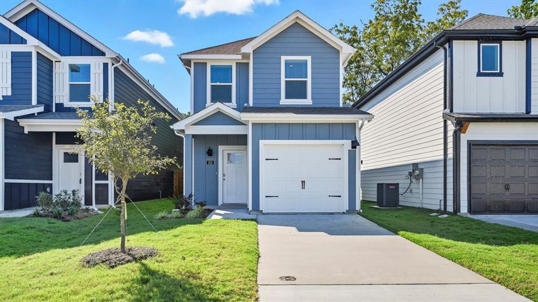 View of front of property with board and batten siding, roof with shingles, a front lawn, and concrete driveway View of front of property with board and batten siding, roof with shingles, a front lawn, and concrete driveway