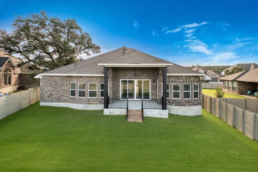 Exterior details and patio area of a home in The Grove at Vintage Oaks, New Braunfels (Image 3).