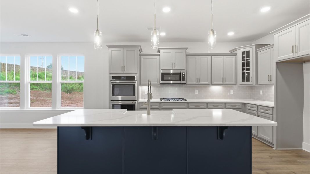 Exclusive kitchen design with large island, pendant lights, and tasteful finishes throughout in Piedmont, SC Exclusive kitchen design with large island, pendant lights, and tasteful finishes throughout in Piedmont, SC
