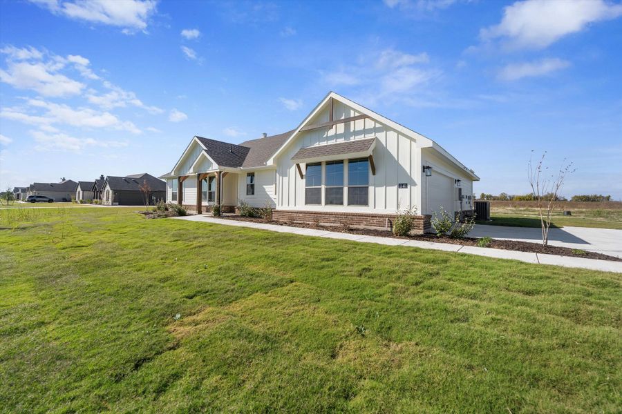 Front exterior of a new home in Clear Sky Addition, Valley View, TX, highlighting curb appeal (Image 23). Front exterior of a new home in Clear Sky Addition, Valley View, TX, highlighting curb appeal (Image 23).