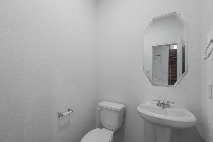 This charming home features a beautifully appointed half bath adjacent to the family room, perfect for welcoming guests and adding convenience to your daily life. This charming home features a beautifully appointed half bath adjacent to the family room, perfect for welcoming guests and adding convenience to your daily life.