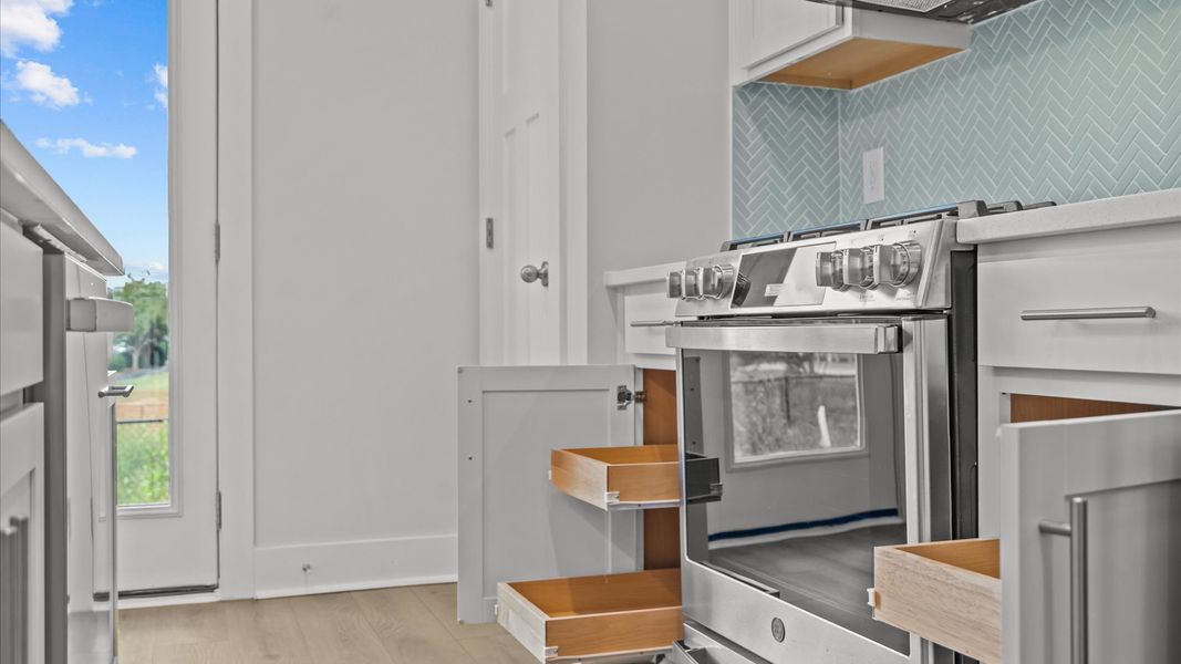 Notable 9-foot island provides generous prep and gathering space in this thoughtfully designed kitchen