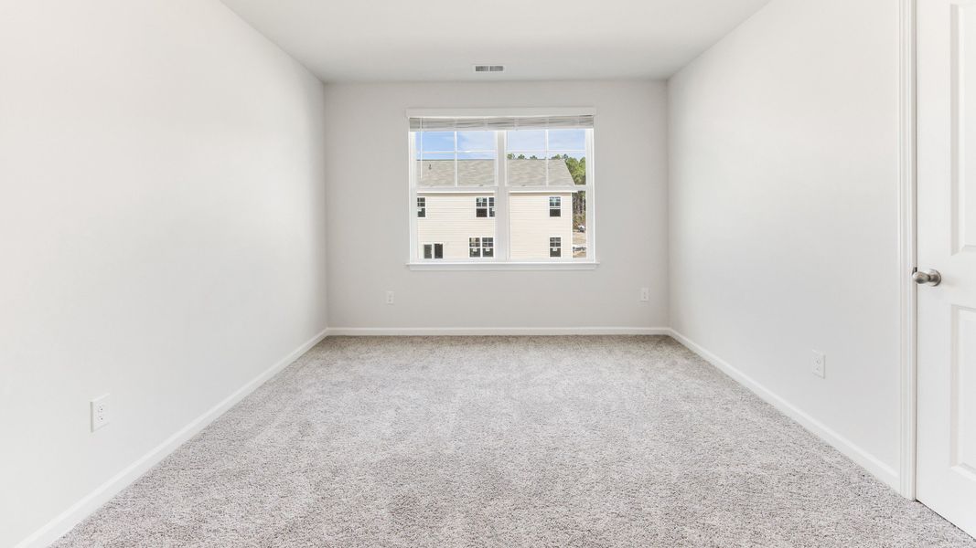 Representative unfurnished interior of a home built from the HAYDEN by D.R. Horton in Sidbury Station, Castle Hayne (Image 28).