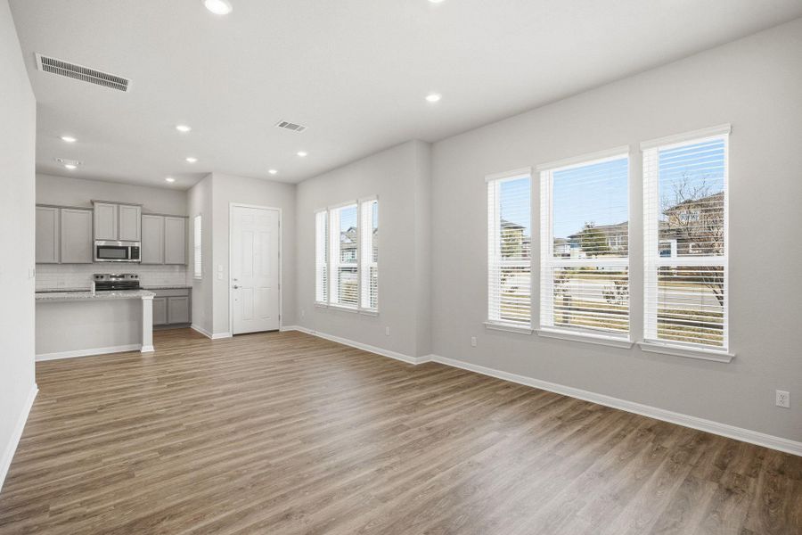 Unfurnished living room with light wood finished floors and recessed lighting
