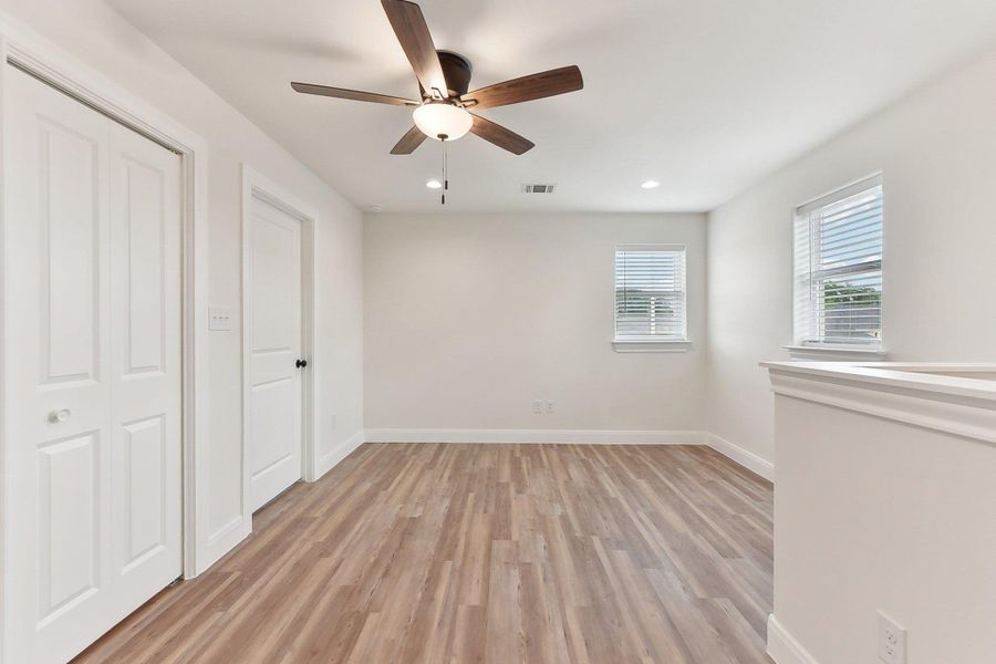 Upstairs Family Area with a ceiling fan, light wood finished floors, baseboards, visible vents, and recessed lighting