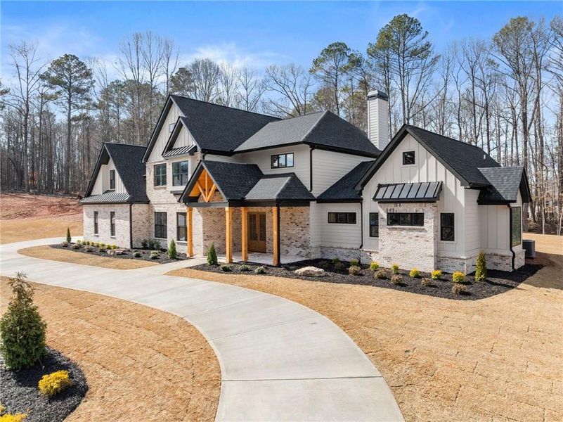 Front exterior of a new home in , Hoschton, GA, highlighting curb appeal (Image 27).