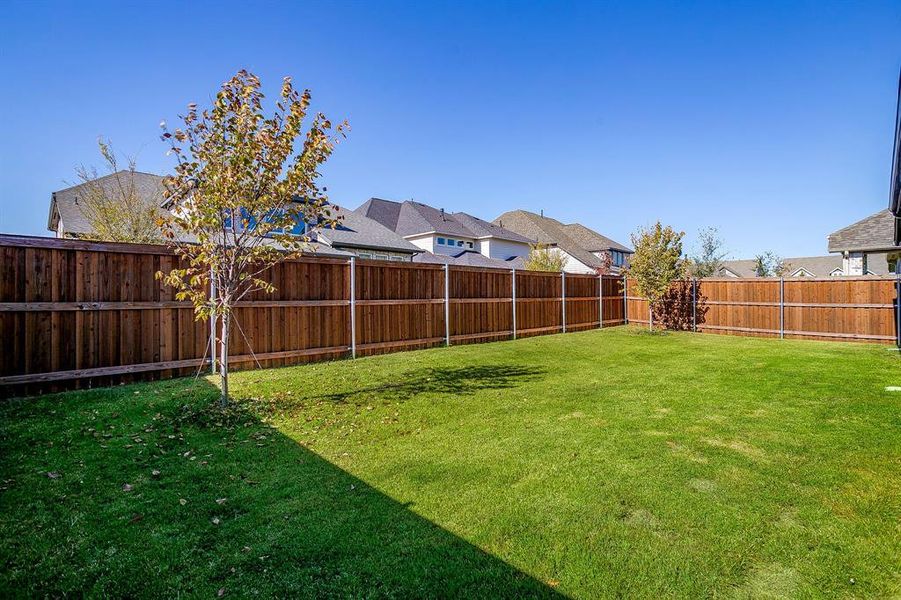 Exterior details and patio area of a home in Walsh 70', Fort Worth (Image 22).
