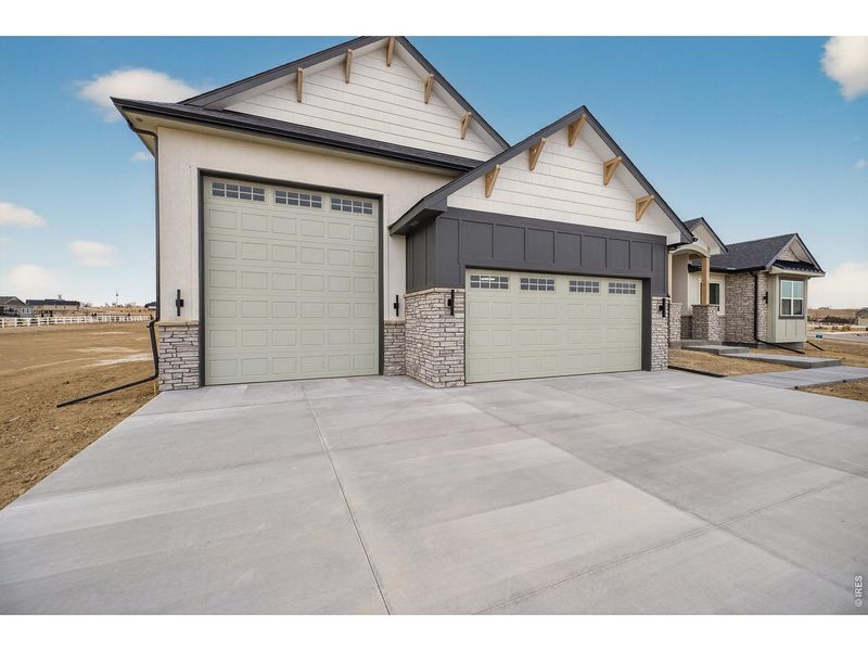 Front exterior of a new home in , Severance, CO, highlighting curb appeal (Image 2).