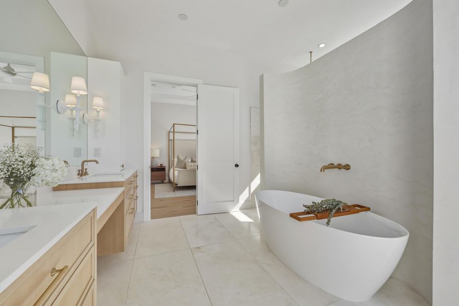 Honed Mosa Marble tiled flooring and shower walls.