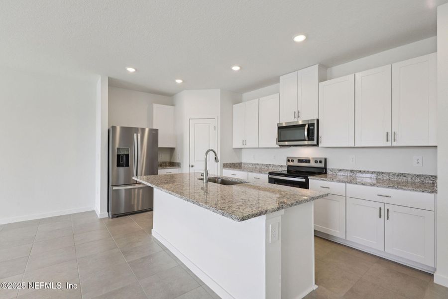 Furnished interior view inside a new home in Lakes at Bella Lago - Signature Series, Green Cove Springs (Image 8). Furnished interior view inside a new home in Lakes at Bella Lago - Signature Series, Green Cove Springs (Image 8).