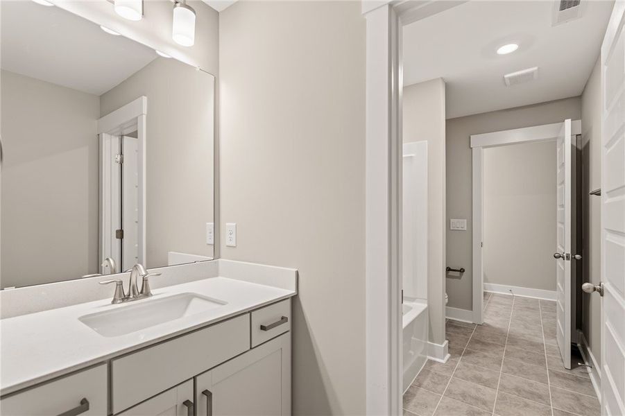A well-appointed bathroom features a crisp white v