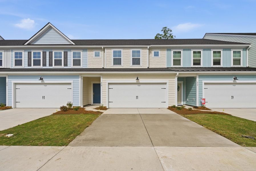 Front exterior of a new home in Ashley Walk Townes, Charleston, SC, highlighting curb appeal (Image 1). Front exterior of a new home in Ashley Walk Townes, Charleston, SC, highlighting curb appeal (Image 1).