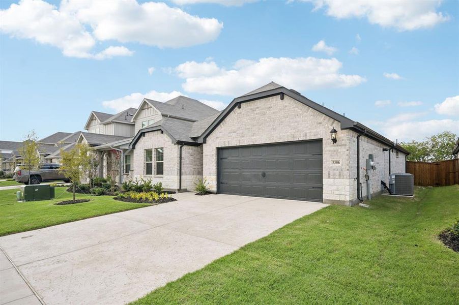 Front exterior of a new home in Lakehaven - Signature Series, Farmersville, TX, highlighting curb appeal (Image 21). Front exterior of a new home in Lakehaven - Signature Series, Farmersville, TX, highlighting curb appeal (Image 21).