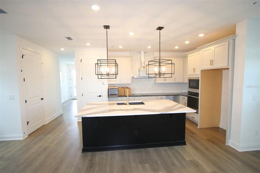 Furnished interior view inside a new home in Weslyn Park in Sunbridge 34', St. Cloud (Image 4).