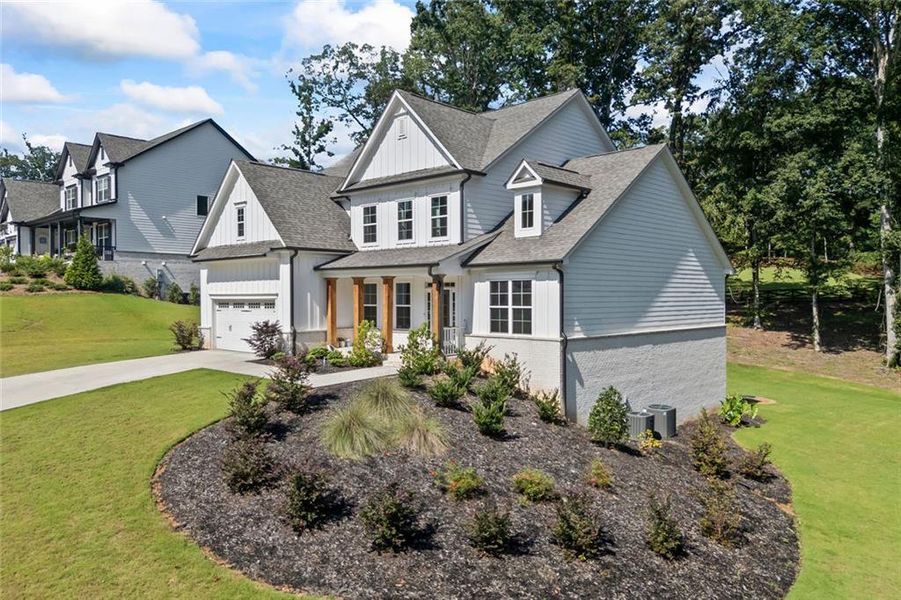 Front exterior of a new home in , Hoschton, GA, highlighting curb appeal (Image 24). Front exterior of a new home in , Hoschton, GA, highlighting curb appeal (Image 24).