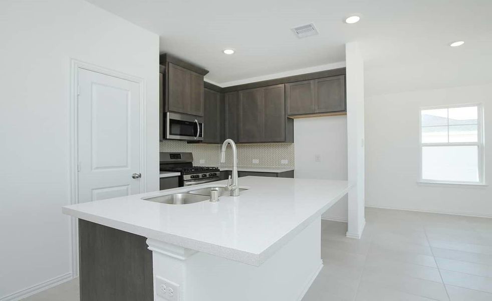 Furnished interior view inside a new home in Lexington Village, Missouri City (Image 3).