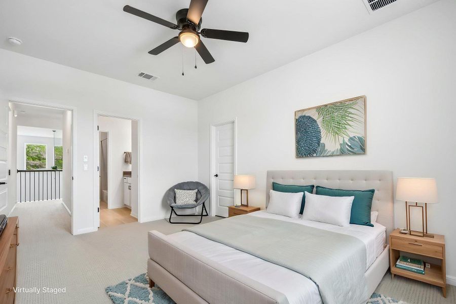 A comfortably proportioned bedroom offers serene living with an adjoining bathroom and a view to a bright landing.