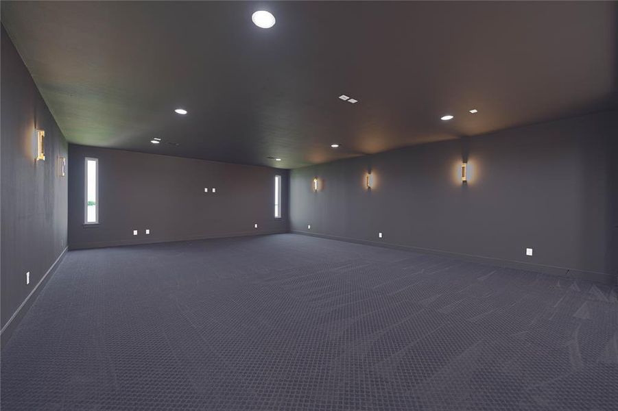 Carpeted spare room with baseboards and recessed lighting Carpeted spare room with baseboards and recessed lighting