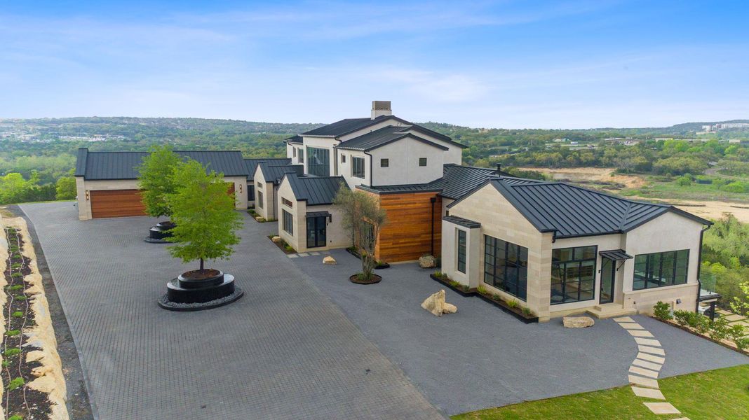 Front exterior of a new home in , Austin, TX, highlighting curb appeal (Image 1). Front exterior of a new home in , Austin, TX, highlighting curb appeal (Image 1).