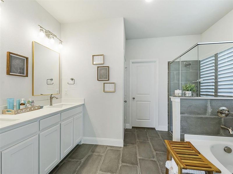 Bathroom with plus walk in shower and vanity