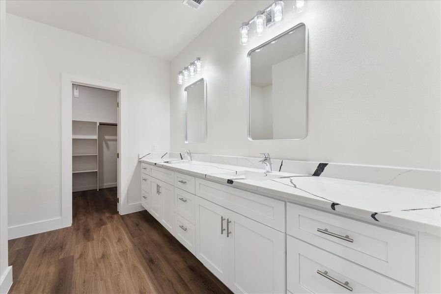 primary bathroom with his and her sink